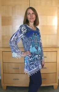 Loose, gauzy top with purple skinny jeans from last month